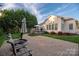 Backyard with patio, deck, and lush lawn at 1108 Butterburr Dr, Matthews, NC 28104