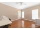 Bedroom with hardwood floors, ceiling fan, and plenty of natural light at 1108 Butterburr Dr, Matthews, NC 28104