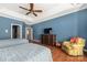 Main bedroom with hardwood floors and ceiling fan at 1108 Butterburr Dr, Matthews, NC 28104