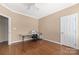 Bedroom with hardwood floors, ceiling fan, and craft station at 1108 Butterburr Dr, Matthews, NC 28104