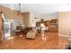 Open concept kitchen and living room with hardwood floors and island at 1108 Butterburr Dr, Matthews, NC 28104