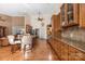 Island kitchen with granite countertops and hardwood floors at 1108 Butterburr Dr, Matthews, NC 28104