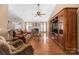 Spacious living room with hardwood floors, fireplace and built-in shelving at 1108 Butterburr Dr, Matthews, NC 28104