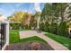 Brick patio with chairs and umbrella at 1108 Butterburr Dr, Matthews, NC 28104