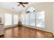 Bright sunroom with hardwood floors and multiple windows at 1108 Butterburr Dr, Matthews, NC 28104