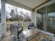 Covered deck with seating area and sliding glass door at 12024 John Newton Dr # 41, Davidson, NC 28036