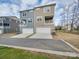 Townhouse exterior with two-car garage and balcony at 12024 John Newton Dr # 41, Davidson, NC 28036