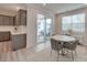 Modern kitchen features gray cabinets, white countertops, and a breakfast bar at 12024 John Newton Dr # 41, Davidson, NC 28036