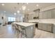 Modern kitchen with gray cabinets, white quartz countertops and island with seating at 12024 John Newton Dr # 41, Davidson, NC 28036