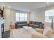 Spacious living room with cozy sectional sofa and fireplace at 12024 John Newton Dr # 41, Davidson, NC 28036