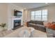 Living room featuring a fireplace and large TV at 12024 John Newton Dr # 41, Davidson, NC 28036