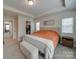 Main bedroom with king bed, walk-in closet, and window at 12024 John Newton Dr # 41, Davidson, NC 28036