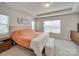 Bright main bedroom with king-size bed and window at 12024 John Newton Dr # 41, Davidson, NC 28036