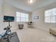 Home office with Peloton bike and work space at 12024 John Newton Dr # 41, Davidson, NC 28036