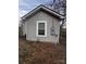 Gray exterior with a window and electrical meter at 1206 N Boyce St, Gastonia, NC 28052