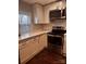 Modern kitchen featuring white cabinets, stainless steel appliances, and quartz countertops at 1206 N Boyce St, Gastonia, NC 28052