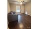 Living room with dark hardwood floors and a comfortable gray couch at 1206 N Boyce St, Gastonia, NC 28052