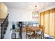 Charming dining area with a round wood table and four chairs, overlooking living room at 1226 Twin Lakes Rd, Rock Hill, SC 29732