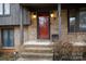 Red front door with brick and wood accents at 1226 Twin Lakes Rd, Rock Hill, SC 29732