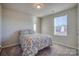 Bedroom with a full bed and floral bedding at 136 Jo Creek Ln, Harmony, NC 28634