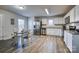 Bright eat-in kitchen with stainless steel appliances and granite countertops at 136 Jo Creek Ln, Harmony, NC 28634