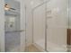 Bathroom with a tiled shower and glass enclosure at 14509 Batteliere Dr, Charlotte, NC 28278