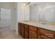 Double vanity bathroom with a large mirror and shower at 14509 Batteliere Dr, Charlotte, NC 28278