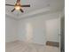 Spacious bedroom with ceiling fan, carpet, and access to bathroom and closet at 14509 Batteliere Dr, Charlotte, NC 28278