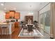 Beautiful dining area with modern lighting, wood floors, and sliding glass door at 14509 Batteliere Dr, Charlotte, NC 28278