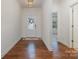 Bright entryway with wood floors leading into living space at 14509 Batteliere Dr, Charlotte, NC 28278