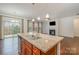 Open floor plan view of kitchen with granite countertops, stainless steel appliances, and view to the living room at 14509 Batteliere Dr, Charlotte, NC 28278