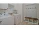 Laundry room with washer and dryer and a sitting bench at 14509 Batteliere Dr, Charlotte, NC 28278