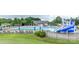 Community pool with a waterslide and plenty of lounge chairs at 14509 Batteliere Dr, Charlotte, NC 28278