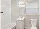 Clean bathroom with white subway tiles, a vanity, and a toilet at 2016 Norwich Pl, Charlotte, NC 28208