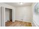 Spacious bedroom with neutral walls, window blinds and wood flooring at 2016 Norwich Pl, Charlotte, NC 28208