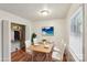 Charming dining area with a wood table and four white chairs at 2016 Norwich Pl, Charlotte, NC 28208