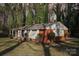 Brick house with covered porch and yard at 2016 Norwich Pl, Charlotte, NC 28208