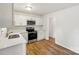 Modern kitchen with white cabinets and stainless steel appliances at 2016 Norwich Pl, Charlotte, NC 28208