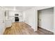 Bright kitchen featuring white cabinets, stainless steel appliances, and light wood flooring at 2016 Norwich Pl, Charlotte, NC 28208