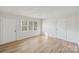 Bright living room with hardwood floors and neutral walls at 2016 Norwich Pl, Charlotte, NC 28208