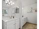 Double vanity bathroom with updated fixtures and tile flooring at 2532 Governors Pointe Ne Ct, Concord, NC 28025