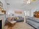 Living room with hardwood floors, fireplace and access to dining area at 2532 Governors Pointe Ne Ct, Concord, NC 28025