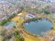 Aerial view of community pool, tennis courts and pond at 2722 Hillmont Dr, Charlotte, NC 28226