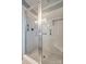 Clean bathroom with a walk-in shower and tiled walls at 2722 Hillmont Dr, Charlotte, NC 28226