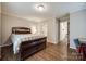 Comfortable bedroom with wood flooring and access to bathroom at 2722 Hillmont Dr, Charlotte, NC 28226