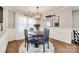 Charming dining room with a round table, four chairs, and stylish chandelier at 2722 Hillmont Dr, Charlotte, NC 28226