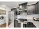 Modern kitchen features stainless steel appliances and granite countertops at 2722 Hillmont Dr, Charlotte, NC 28226