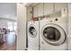 Laundry room with washer and dryer, built-in shelving at 2722 Hillmont Dr, Charlotte, NC 28226