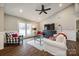 Spacious living room with vaulted ceiling, hardwood floors, and comfy seating at 2722 Hillmont Dr, Charlotte, NC 28226