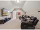 Basement media room with comfortable leather seating and a large flat-screen TV at 4006 Sincerity Rd, Monroe, NC 28110